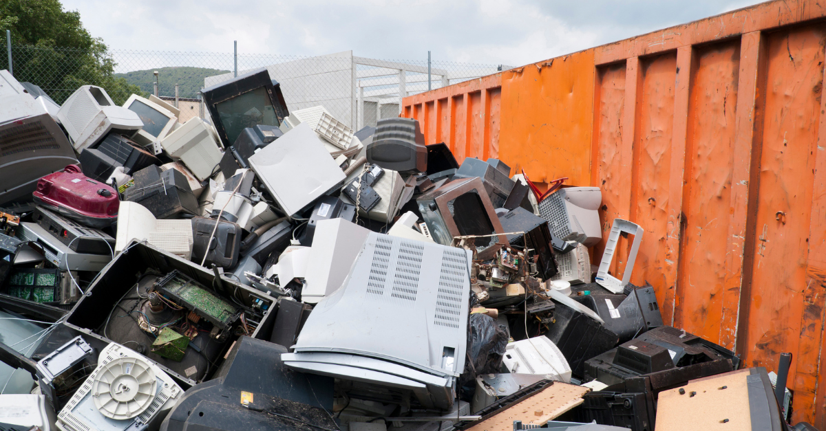 An image of discarded PCs and Monitors